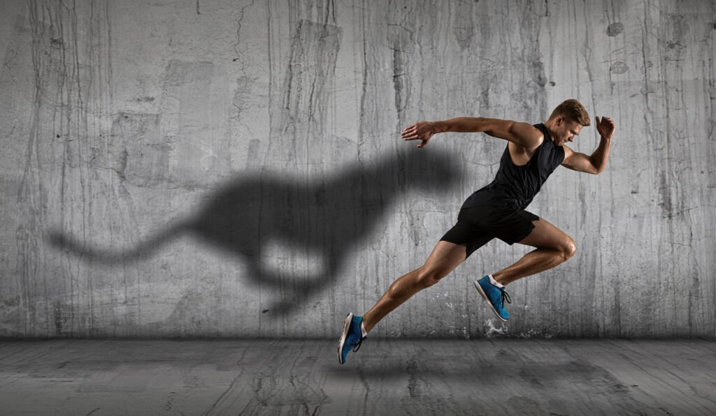 Strong,Athletic,Man,Sprinter,,Running,On,Dark,Wall,Background,Wearing